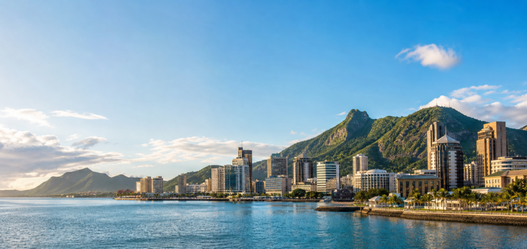Port Louis waterfront skyline and mountains at sunrise
